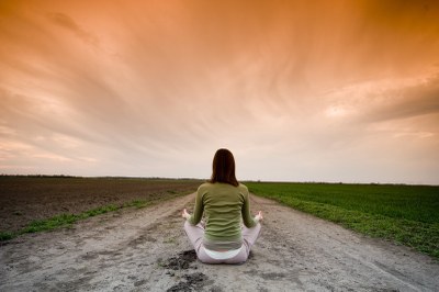 woman meditating in sunset1   canstockphoto1124257